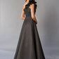 K268063 Dramatic Metallic Jacquard Ball Gown with Ruffle Shoulder Detail and Pockets