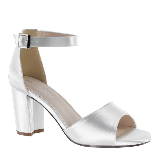 Open toe dyeable shoe with a 2.5 block heel and adjustable strap with buckle.