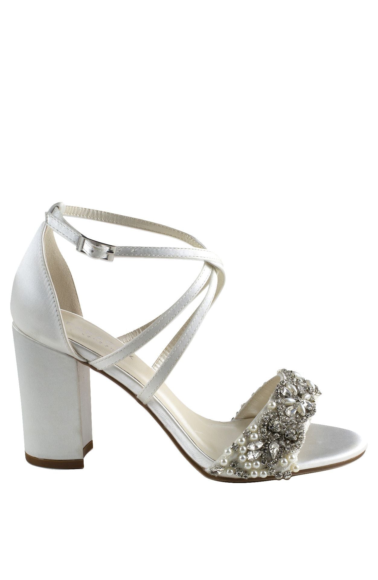 Side view Ivory Sandal with 2.75 inch block heel and decrotive strap